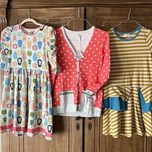 Matilda, Jane, two dresses, and one cardigan.